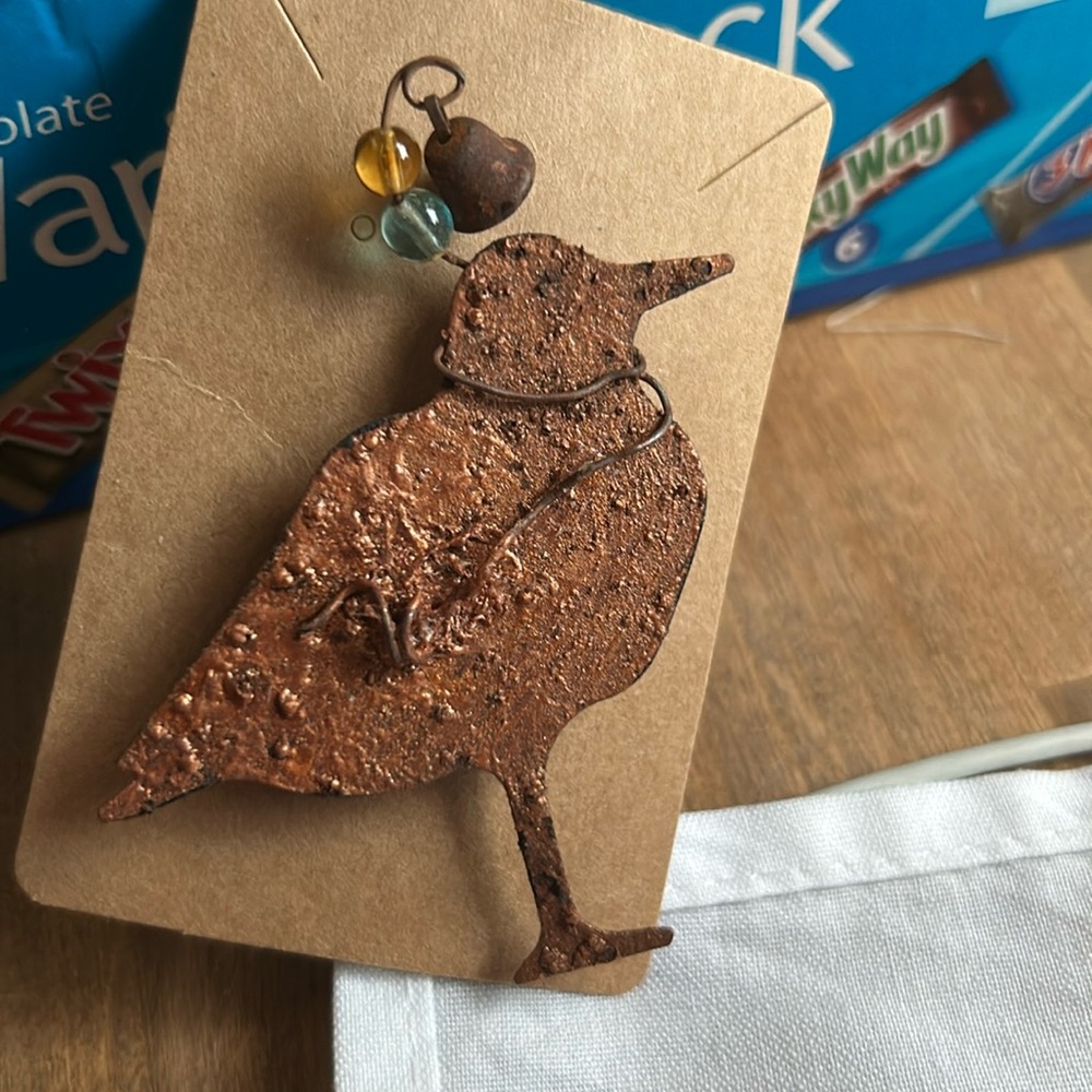 Cute little metal bird pin with movable bell